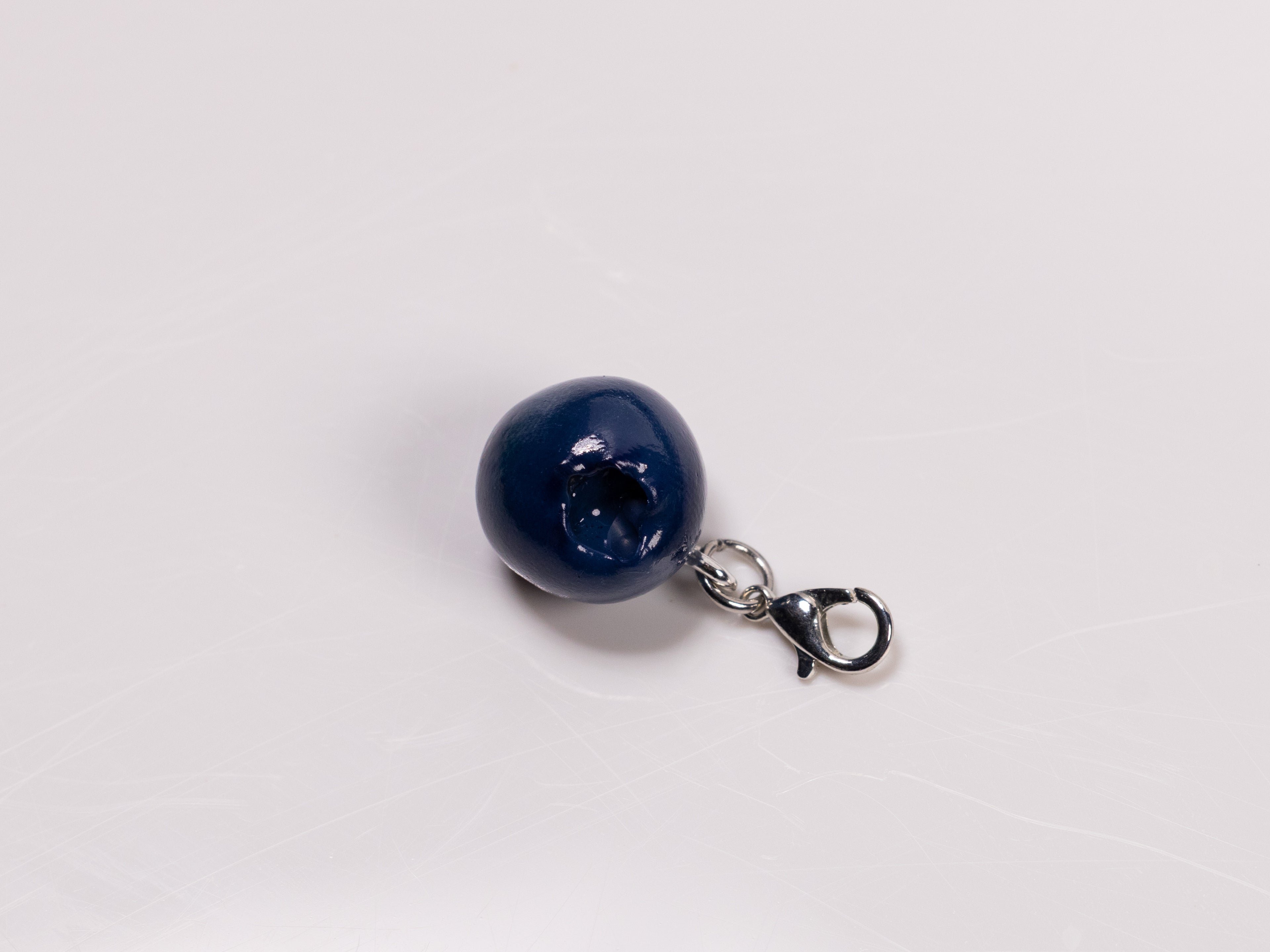 Miniature handmade blueberry clay charm