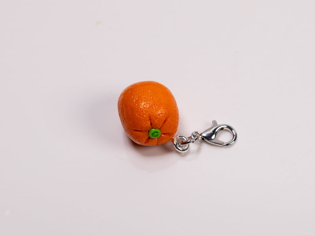 Miniature handmade orange clay charm