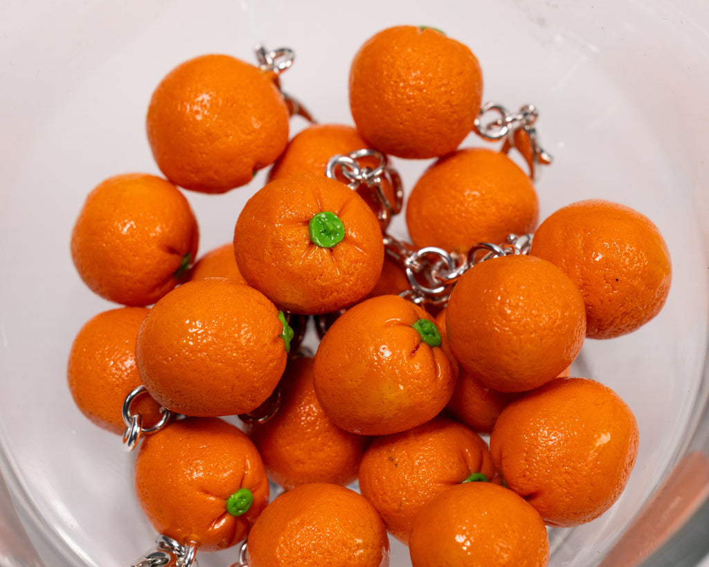 Miniature handmade orange clay charm