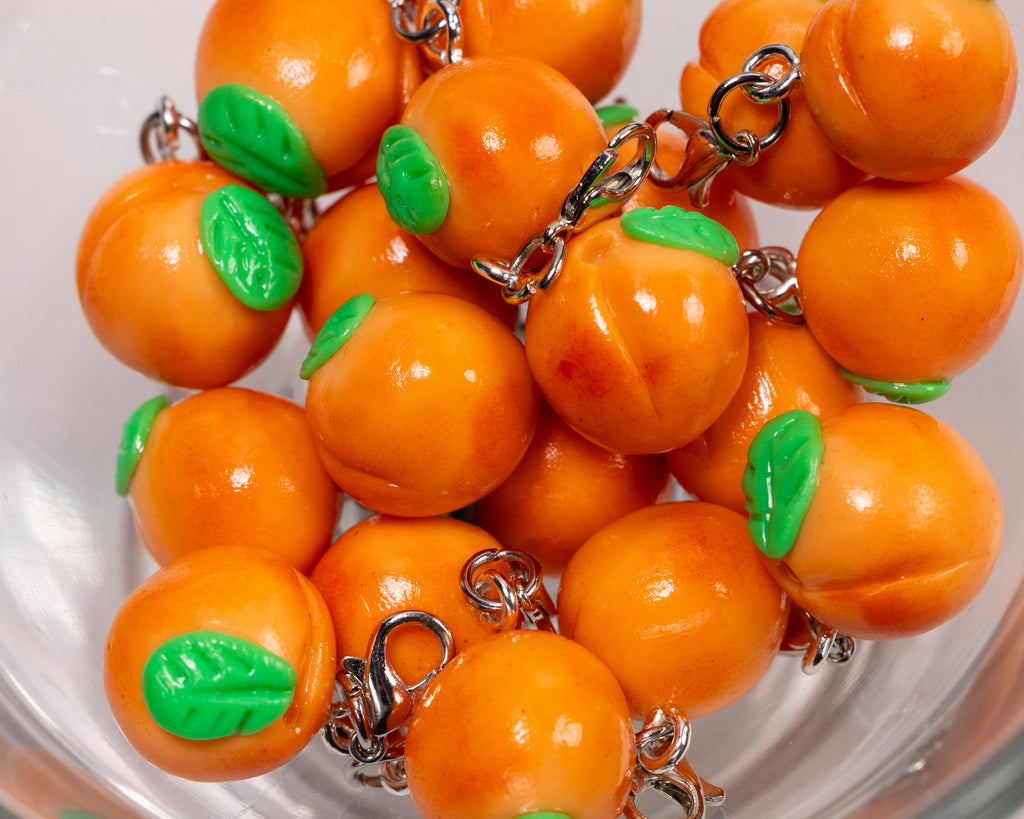 Miniature handmade peach clay charm