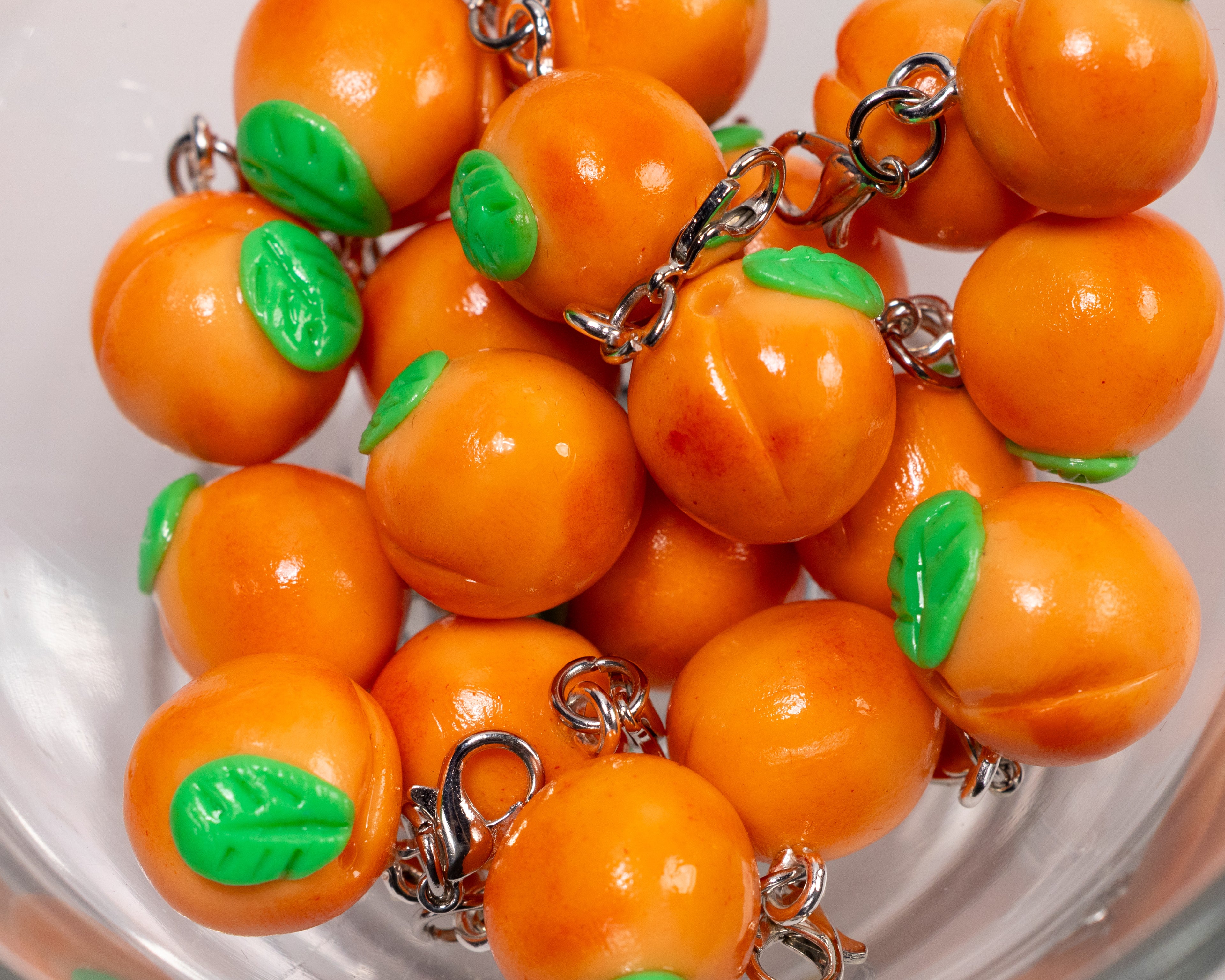 Miniature handmade peach clay charm