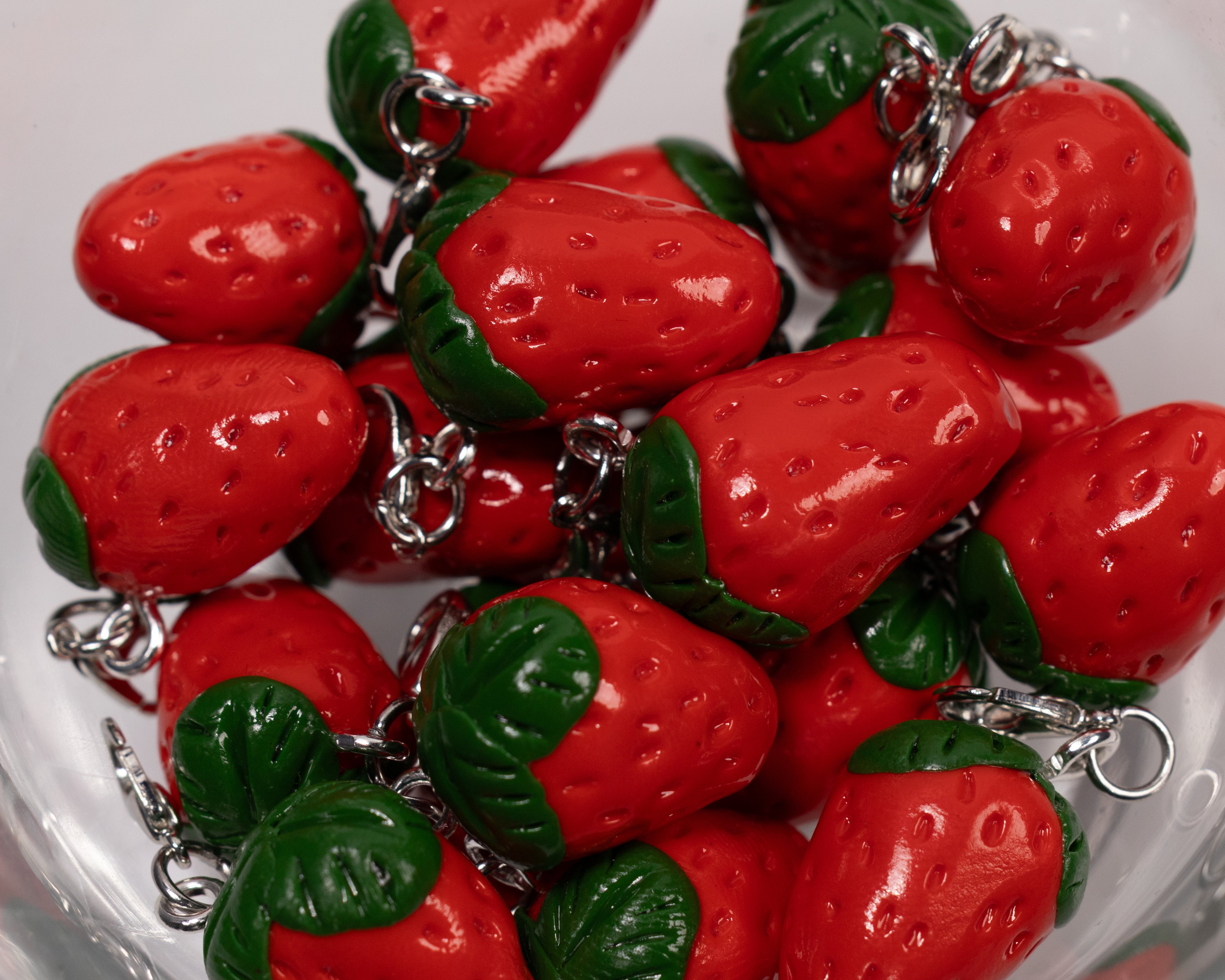 Miniature handmade strawberry clay charm