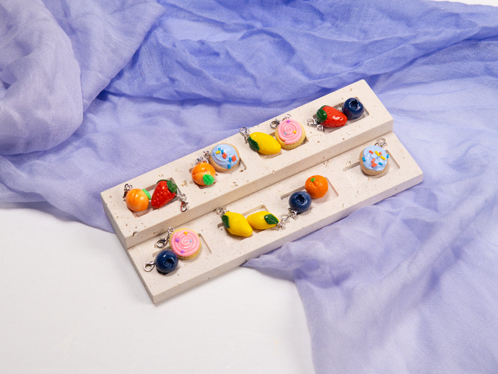 Miniature handmade peach clay charm
