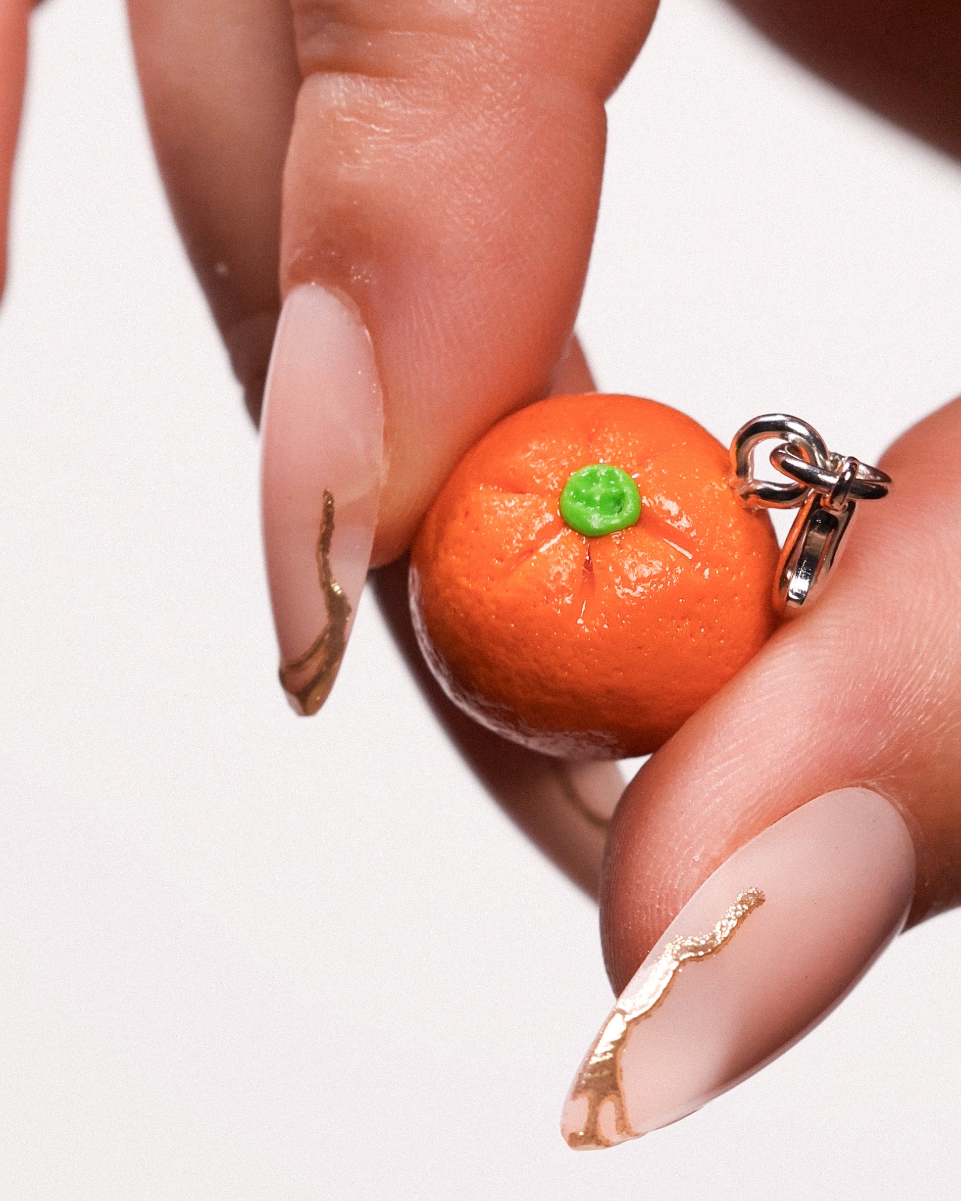 Miniature handmade orange clay charm