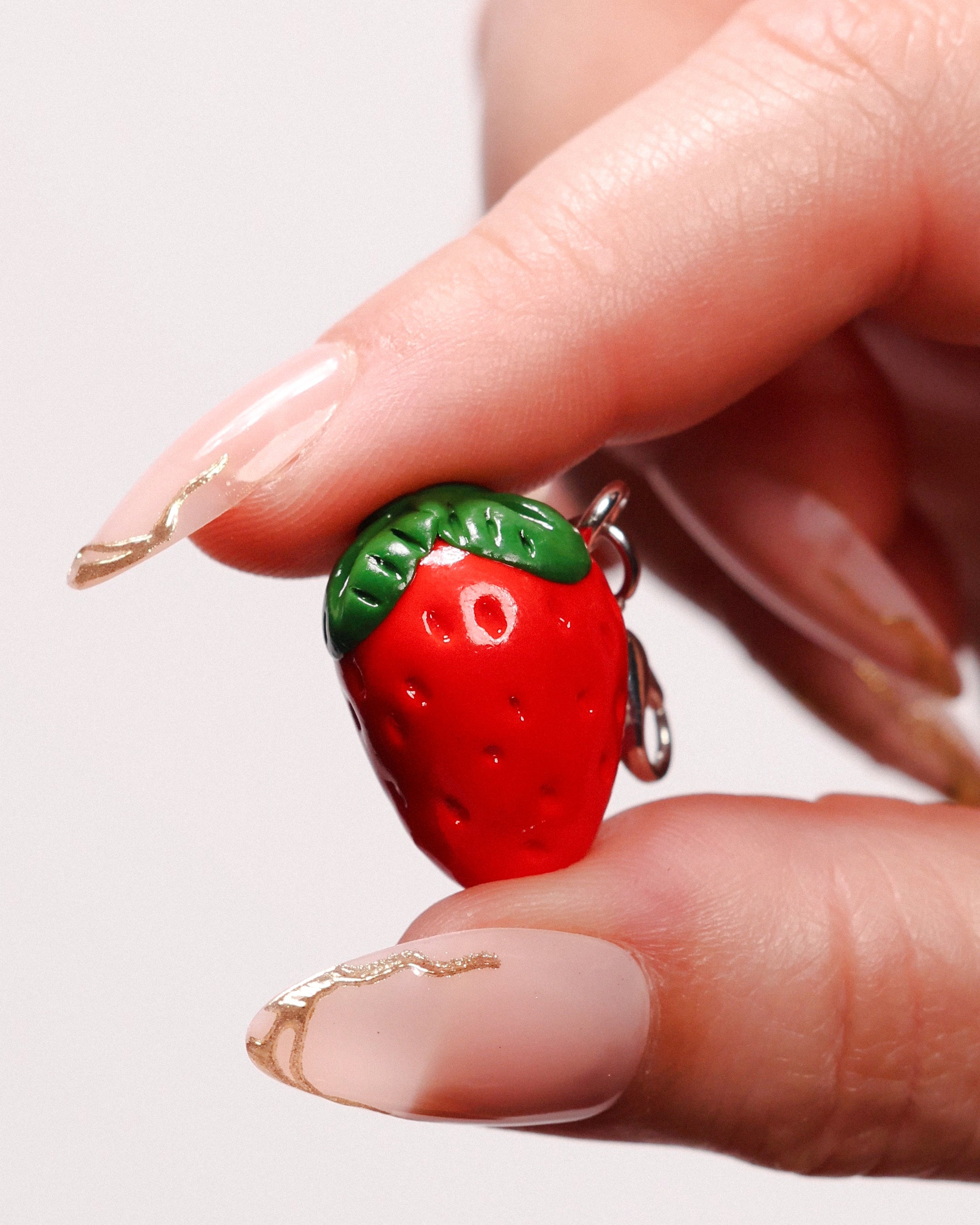 Miniature handmade strawberry clay charm