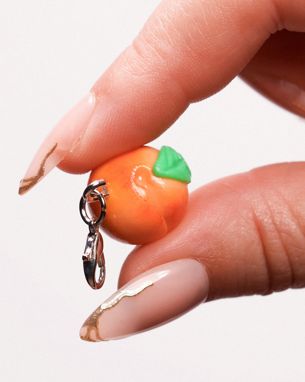 Miniature handmade peach clay charm