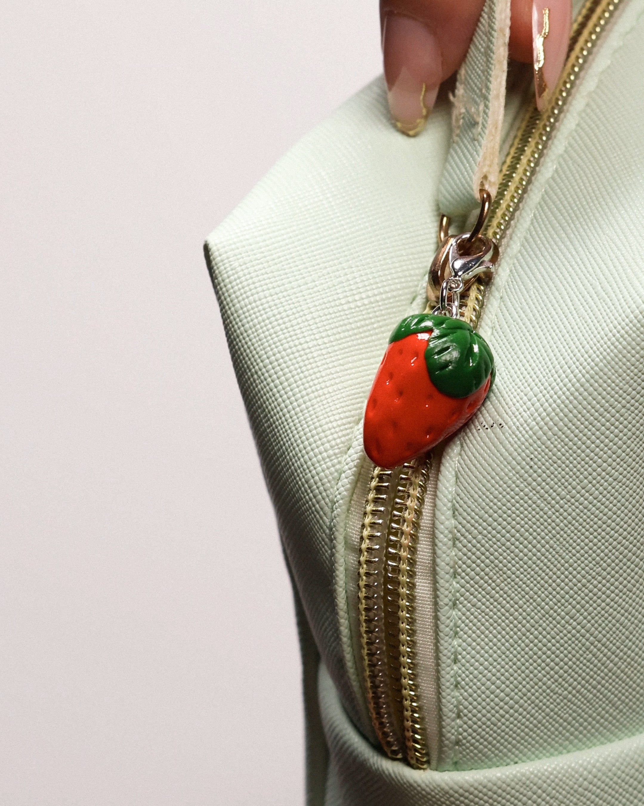 Miniature handmade strawberry clay charm