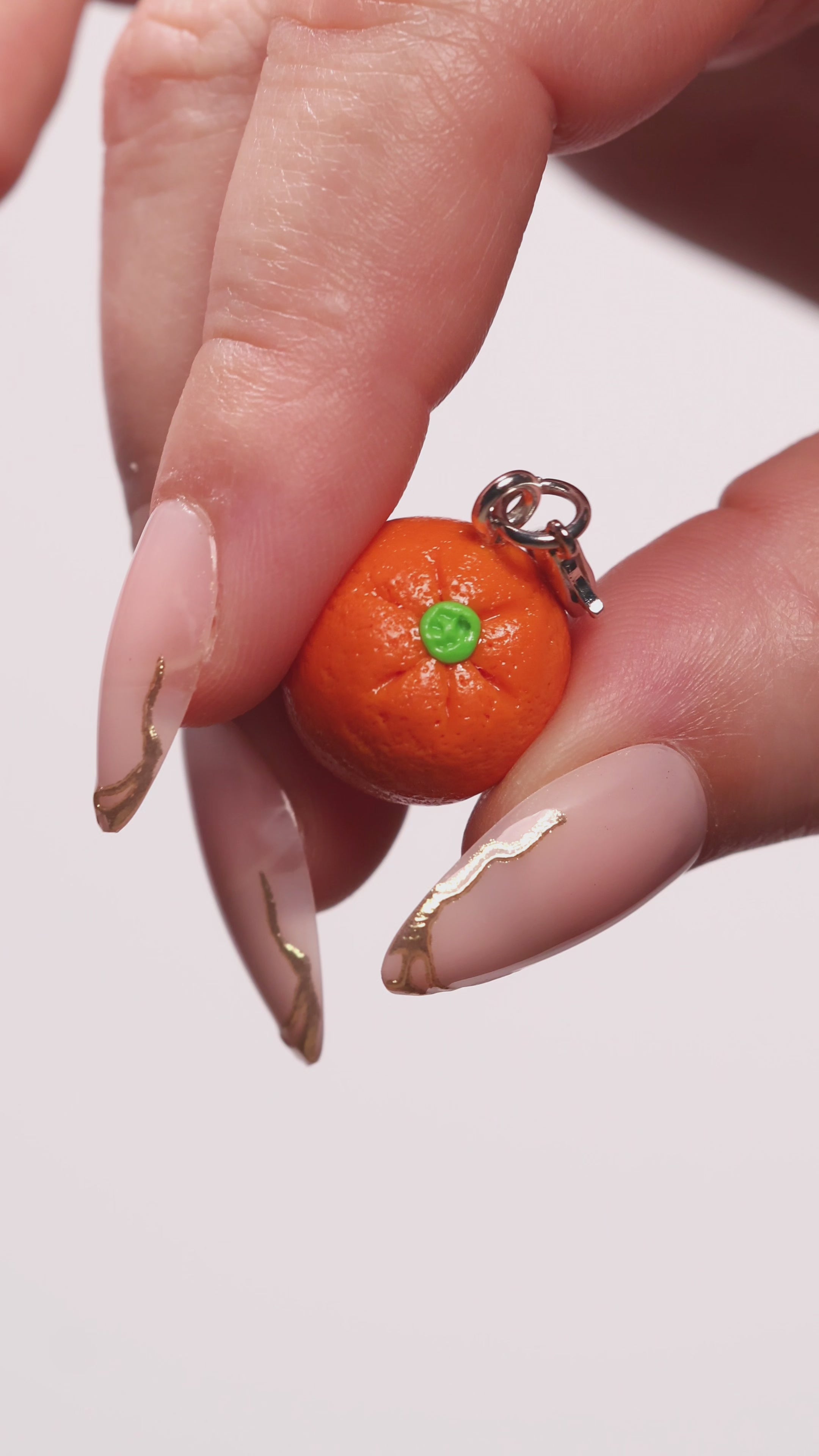Miniature handmade orange clay charm