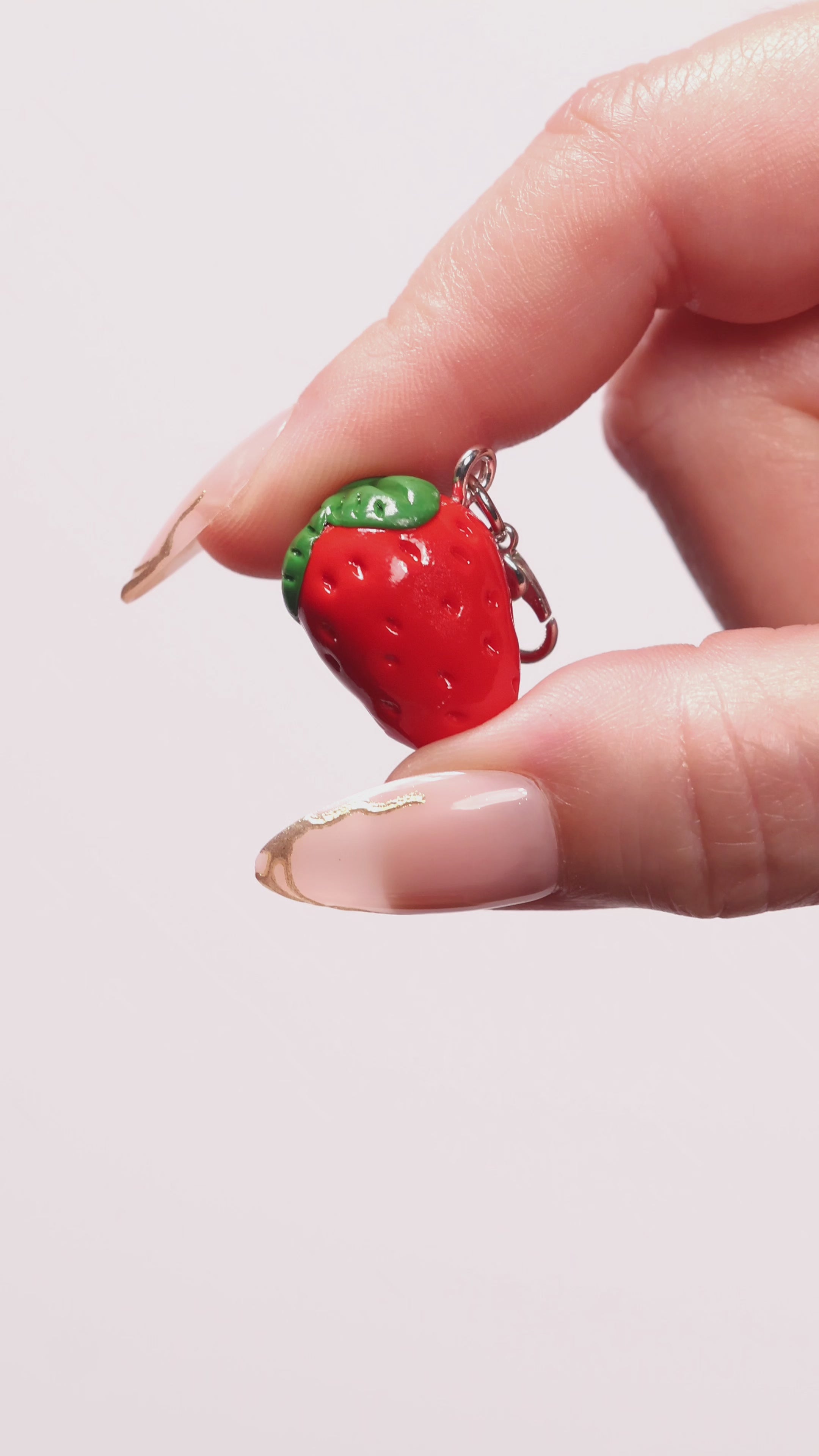 Miniature handmade strawberry clay charm